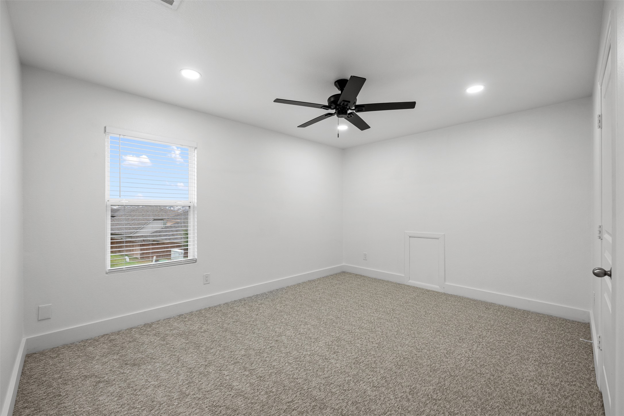 3400 Stephans Street Pflugerville, TX 78660 - Photo 34 of 40 an empty room with a window and a ceiling fan