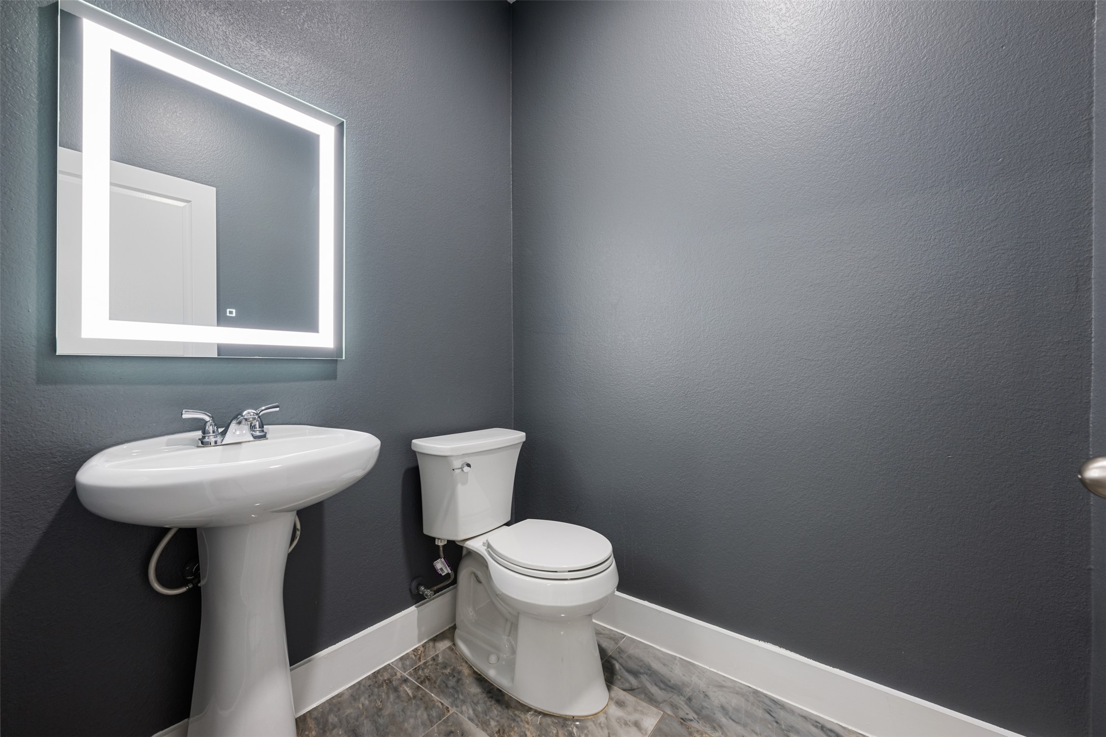 3400 Stephans Street Pflugerville, TX 78660 - Photo 10 of 40 a bathroom with a sink a toilet and mirror