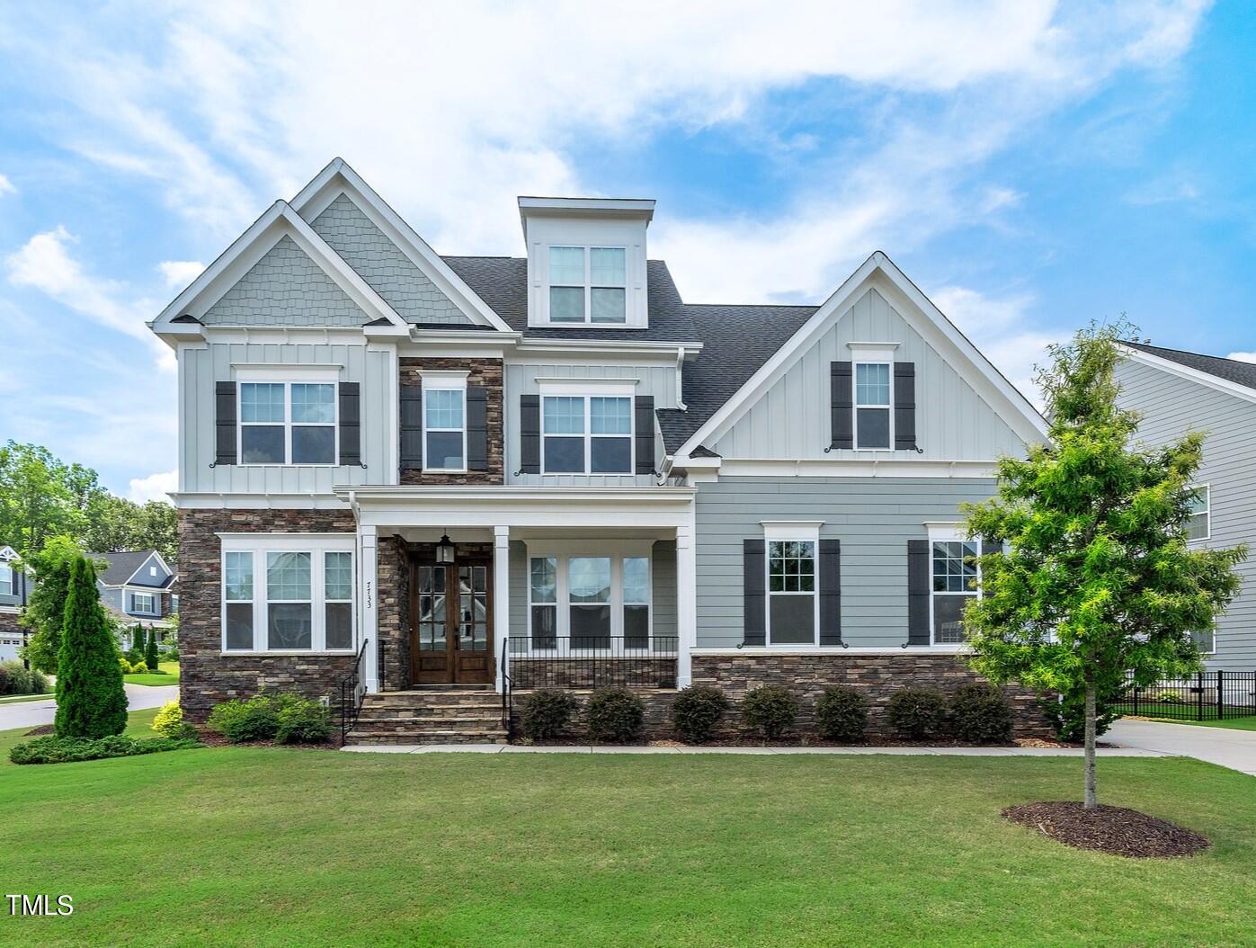 7733 Wilderness Road Raleigh, NC 27613 - Photo 1 of 37 front view of a house with a yard