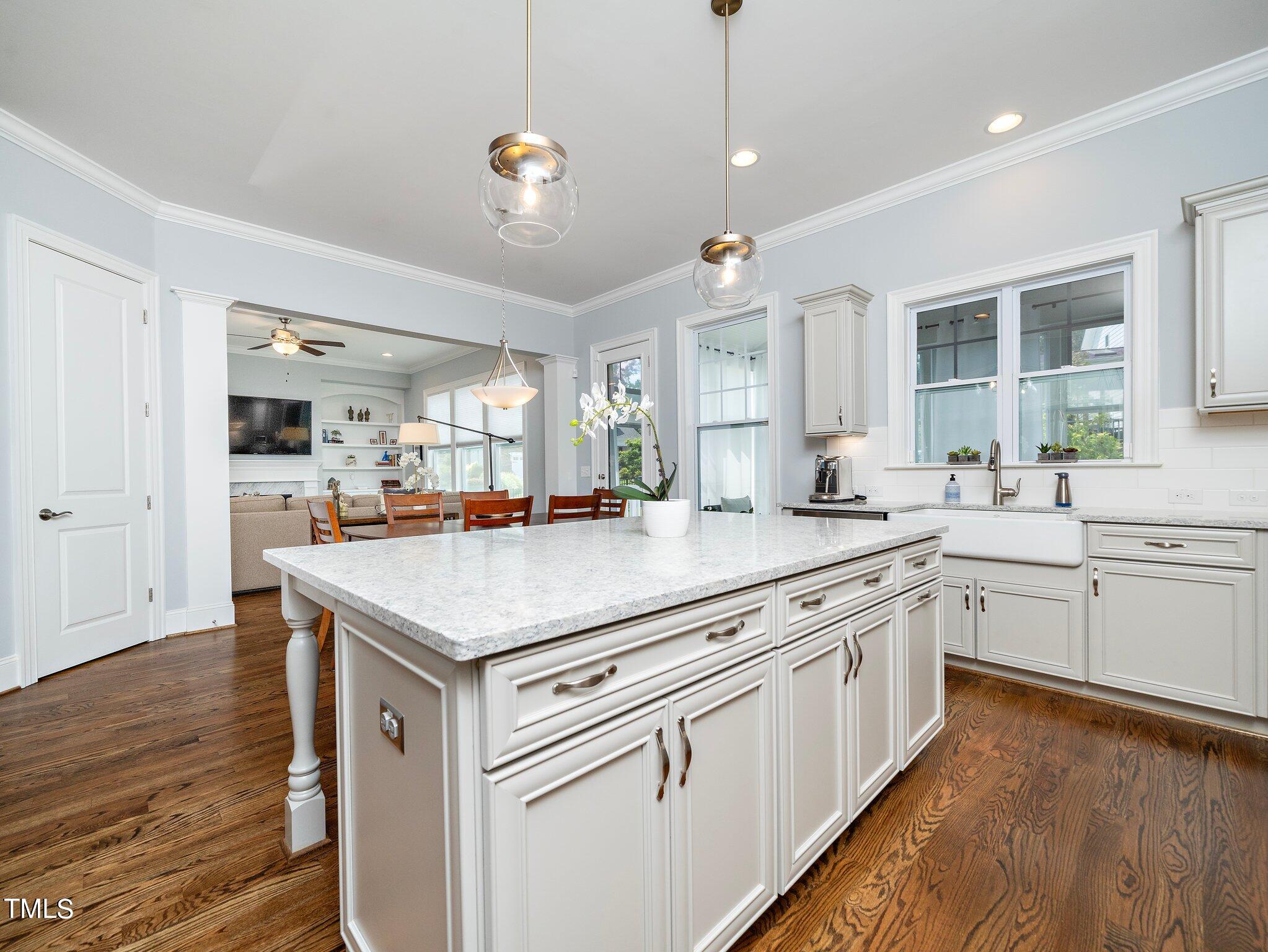7733 Wilderness Road Raleigh, NC 27613 - Photo 17 of 37 a kitchen with stainless steel appliances granite countertop stove a sink dishwasher and a refrigerator with wooden floor