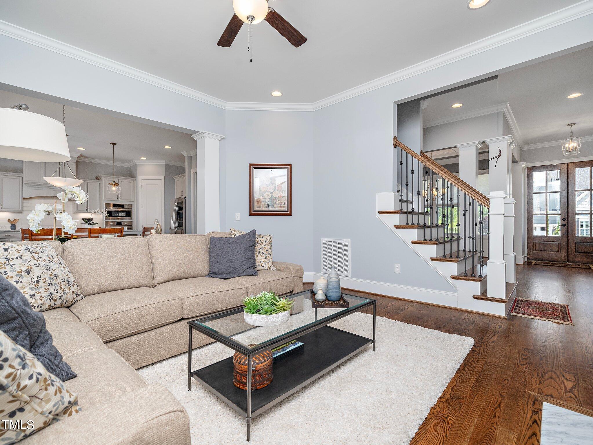 7733 Wilderness Road Raleigh, NC 27613 - Photo 20 of 37 a living room with furniture and wooden floor