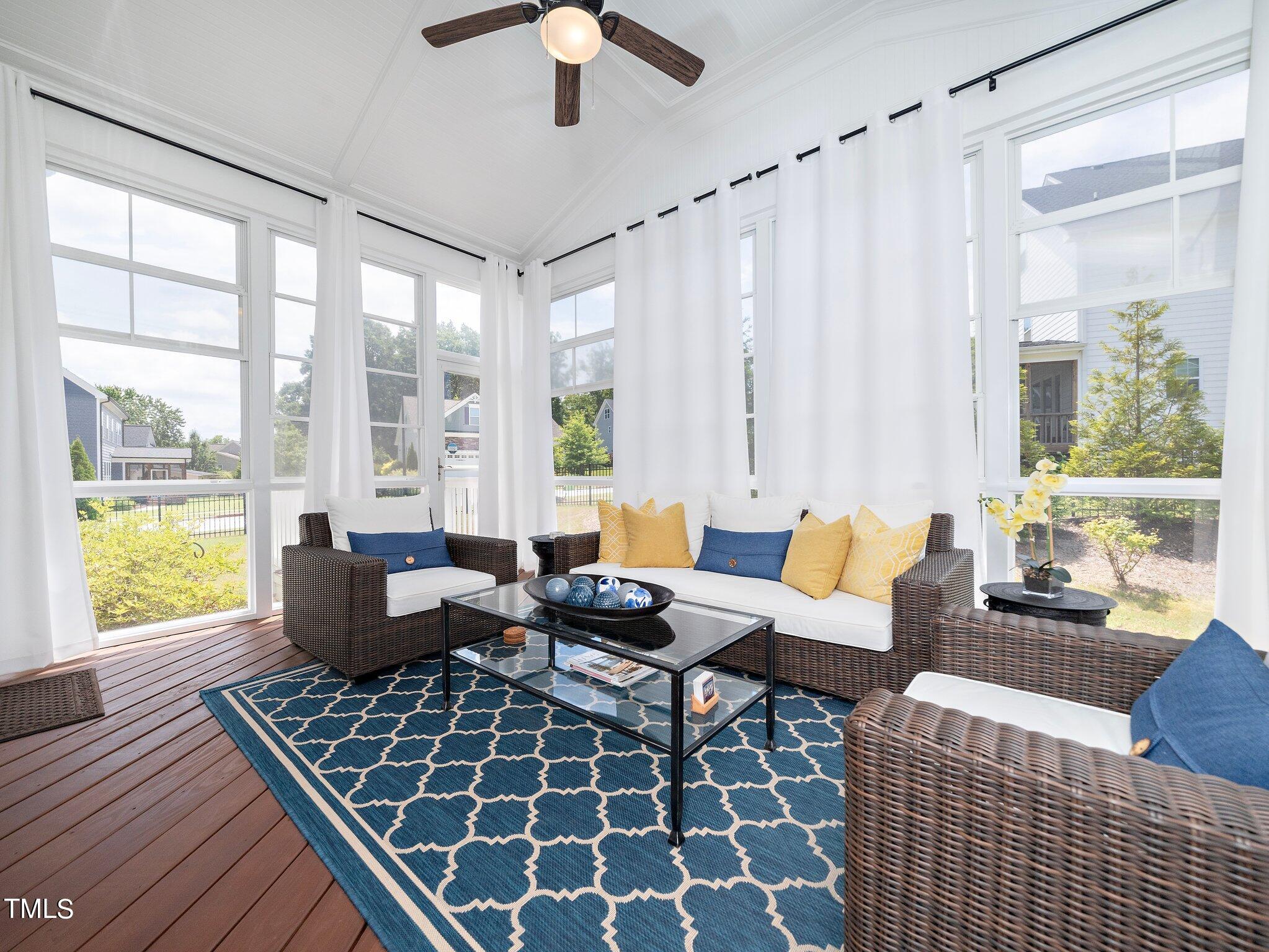 7733 Wilderness Road Raleigh, NC 27613 - Photo 32 of 37 a living room with furniture and a window