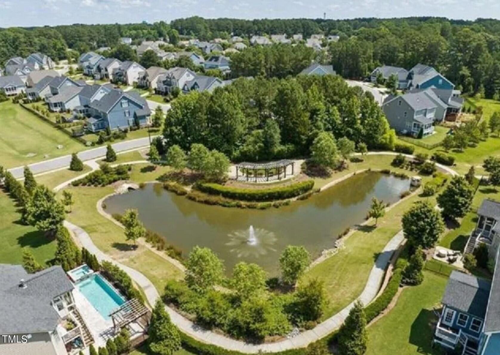 7733 Wilderness Road Raleigh, NC 27613 - Photo 34 of 37 an aerial view of residential houses with outdoor space