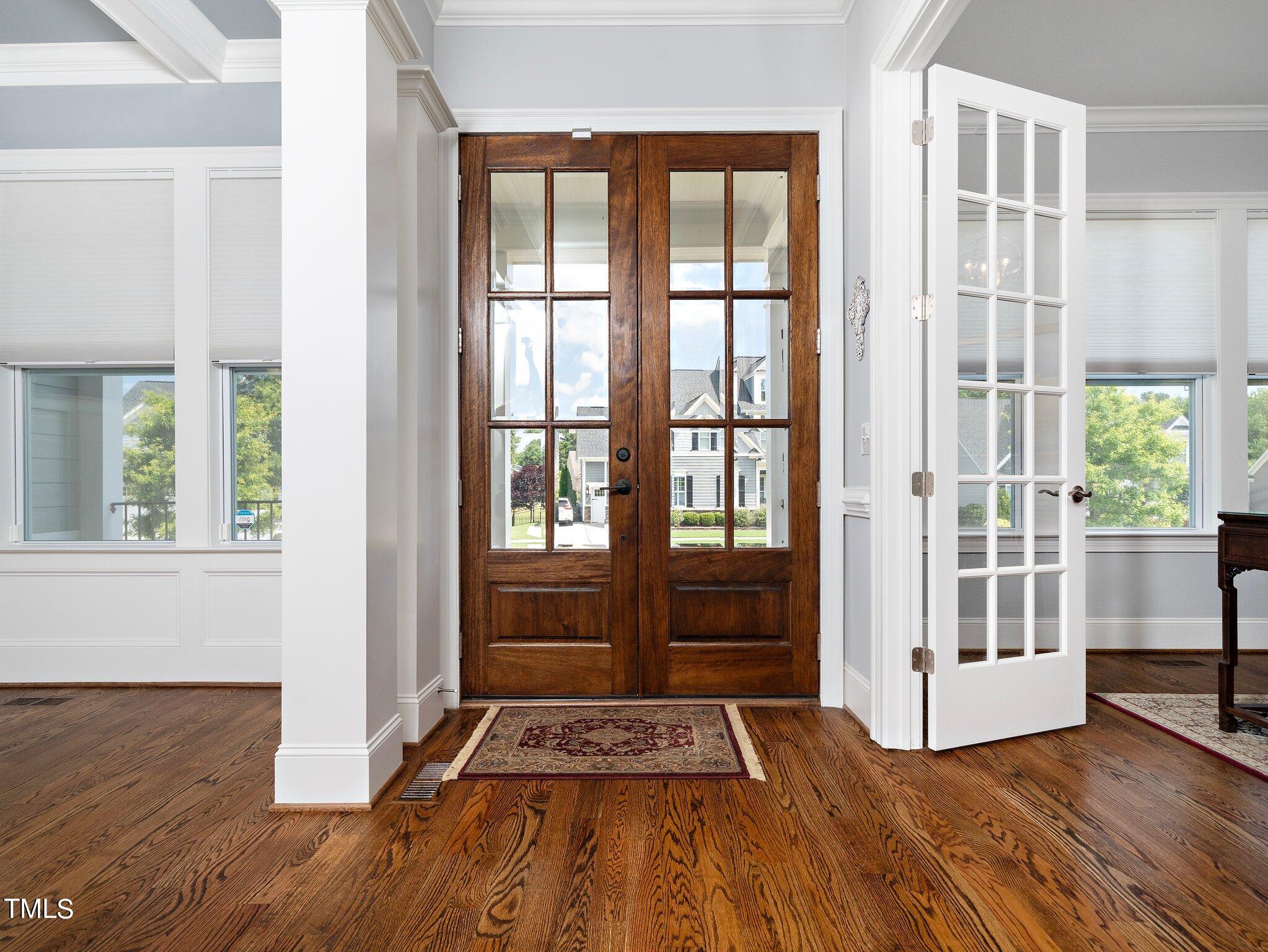 7733 Wilderness Road Raleigh, NC 27613 - Photo 5 of 37 a view of front door with wooden floor