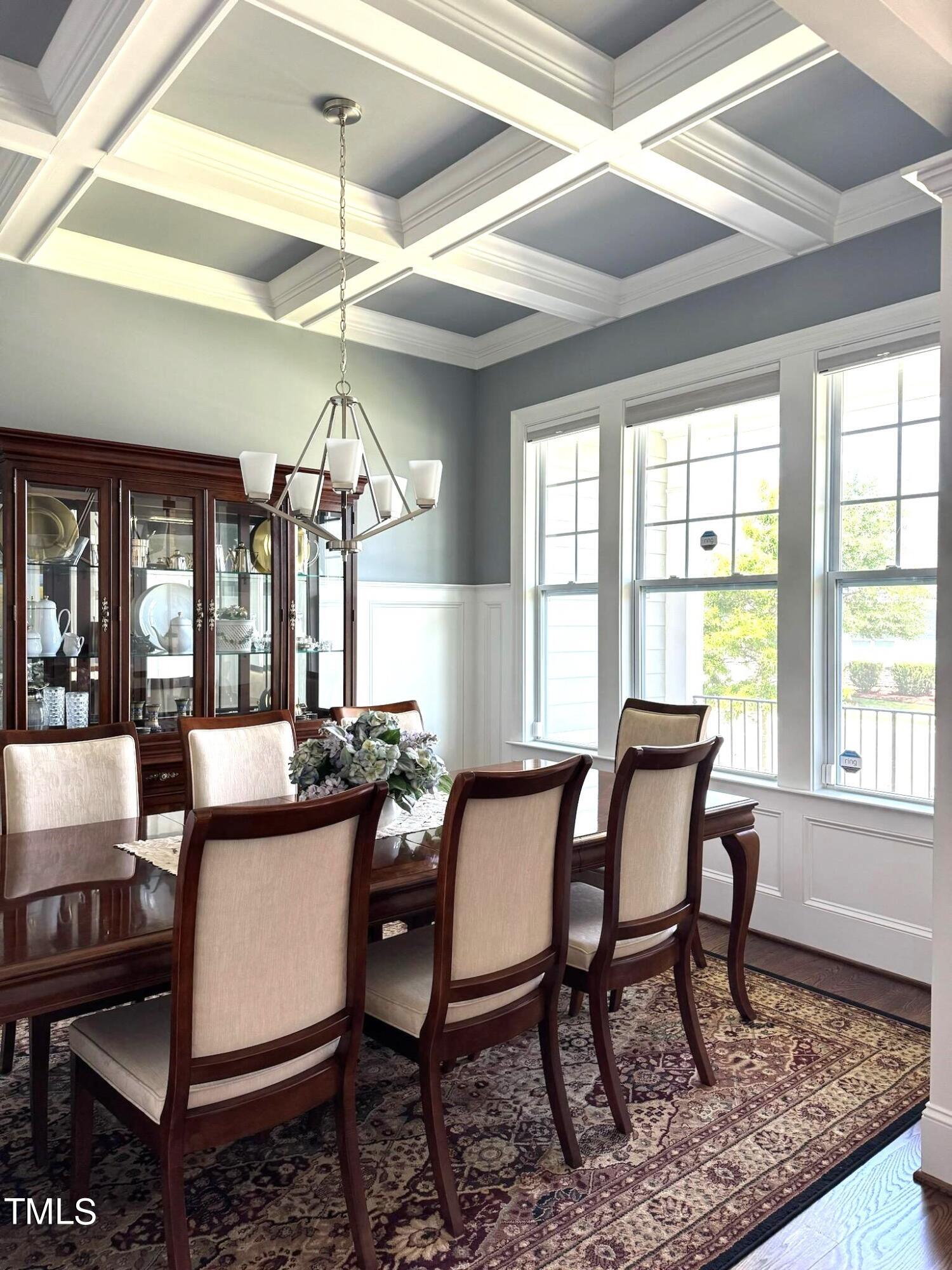 7733 Wilderness Road Raleigh, NC 27613 - Photo 8 of 37 a view of a dining room with furniture window and outside view