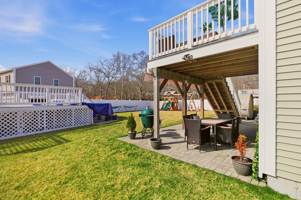 341 Courtney Street Fall River, MA 02720 - Photo 37 of 39 a view of a house with wooden deck and furniture