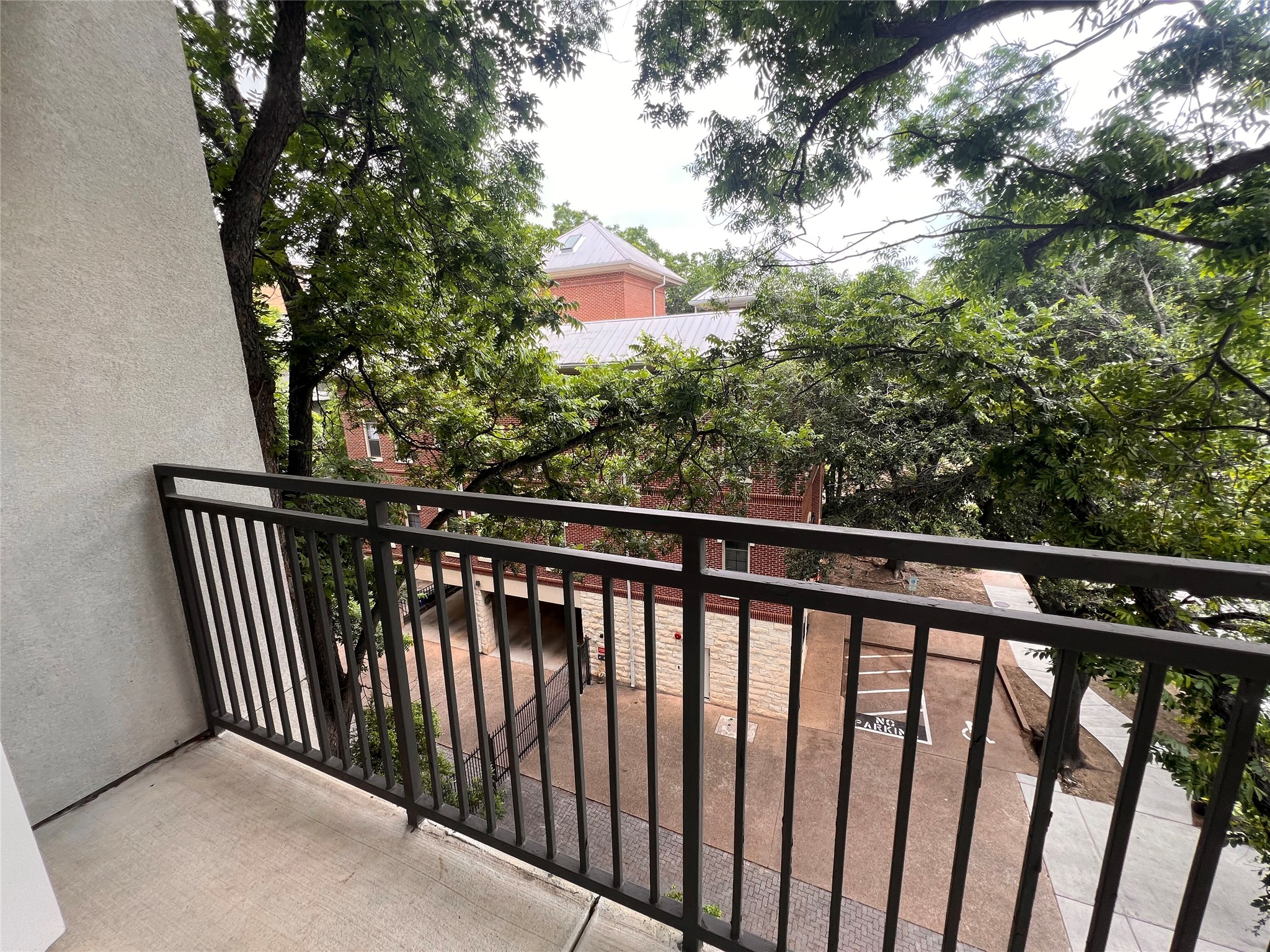 1900 Barton Springs Road, Unit 4041 Austin, TX 78704 - Photo 4 of 35 a balcony with wooden floor and fence