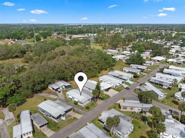 an aerial view of a house with lake view