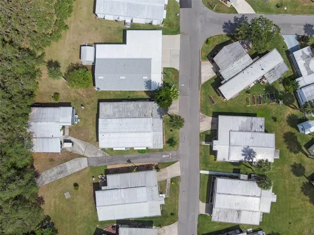 an aerial view of a house with a garden