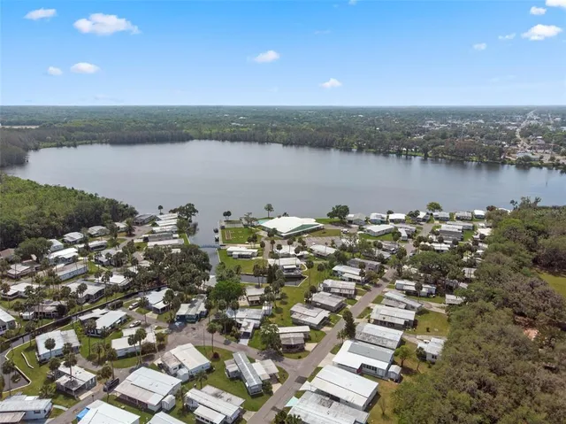 an aerial view of a house with a swimming pool