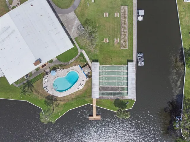 swimming pool view with a seating space