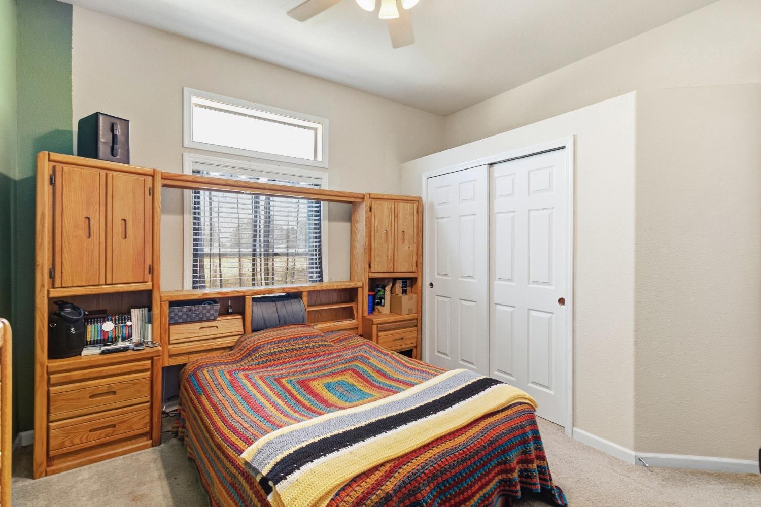 12390 Hobday Road Wilton, CA 95693 - Photo 41 of 92 a bedroom with a bed and a window