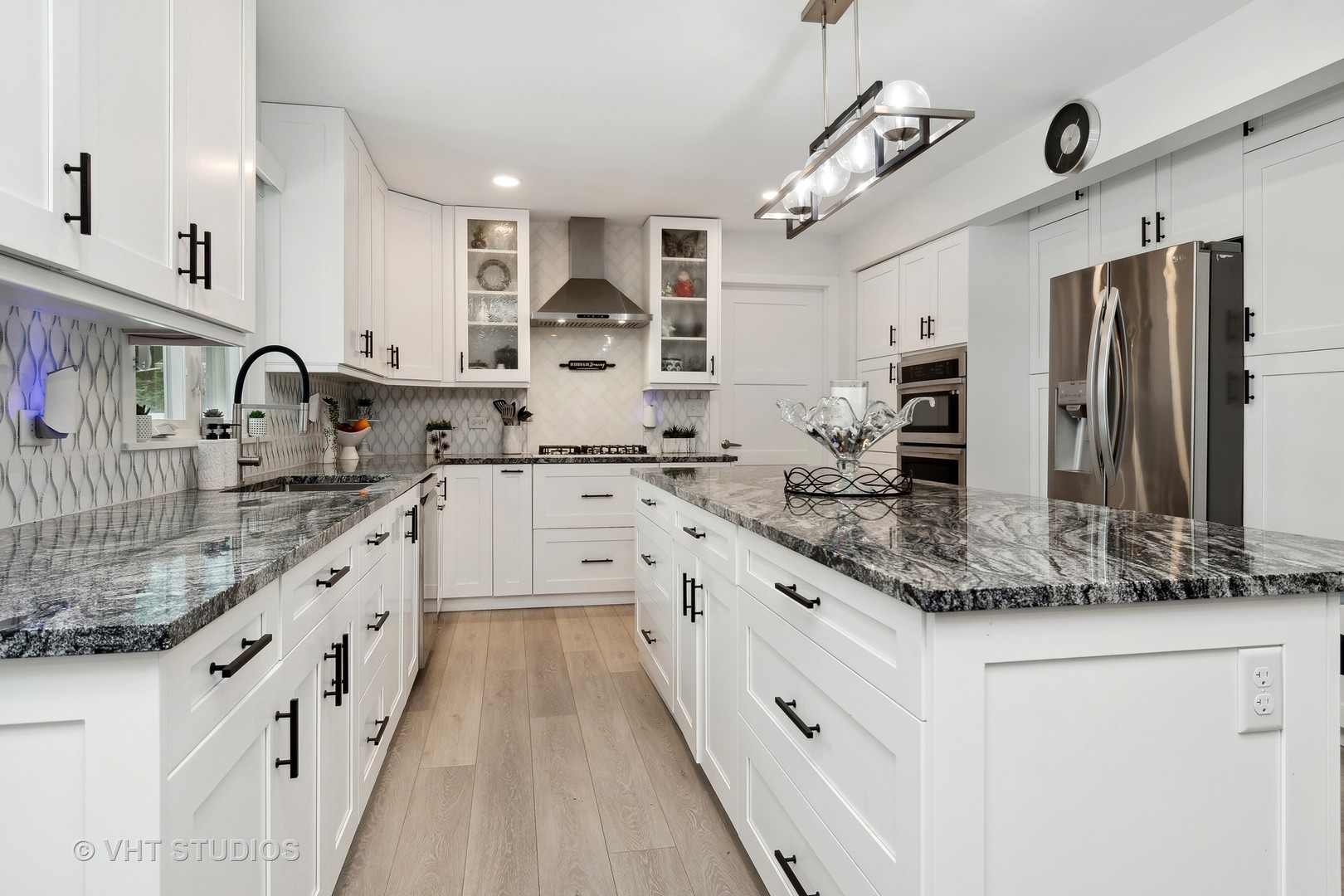14107 Naperville Road Plainfield, IL 60544 - Photo 11 of 49 a kitchen with stainless steel appliances granite countertop a sink and cabinets