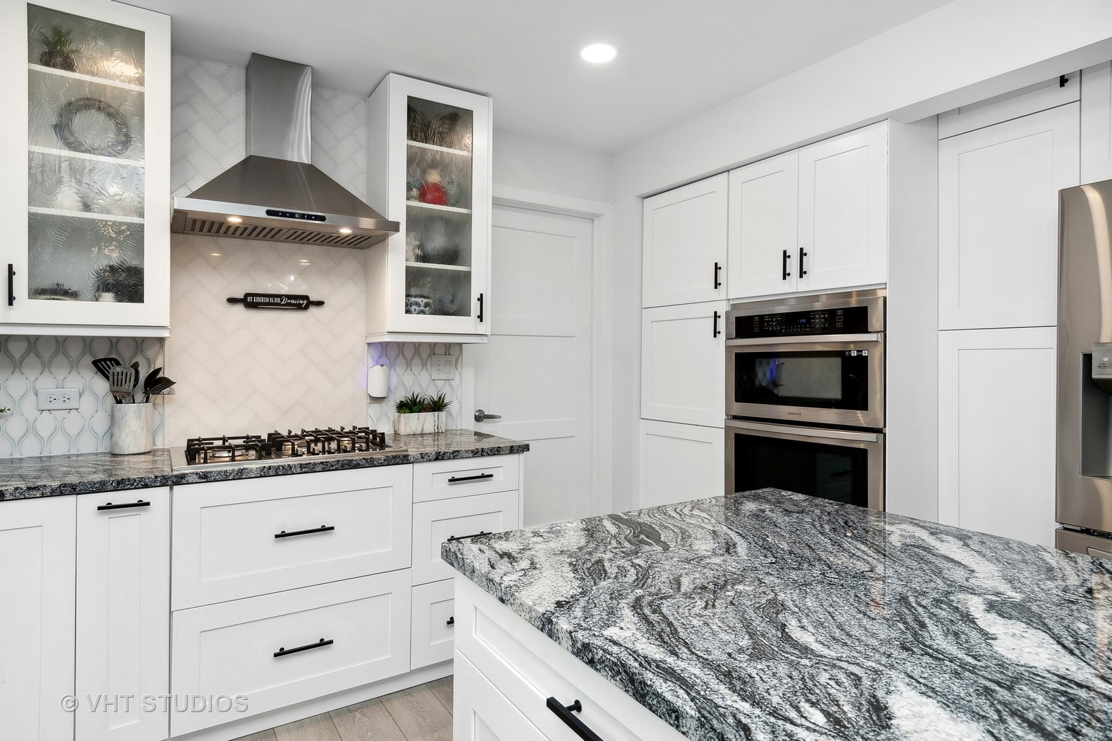 14107 Naperville Road Plainfield, IL 60544 - Photo 12 of 49 a kitchen with a stove and a refrigerator