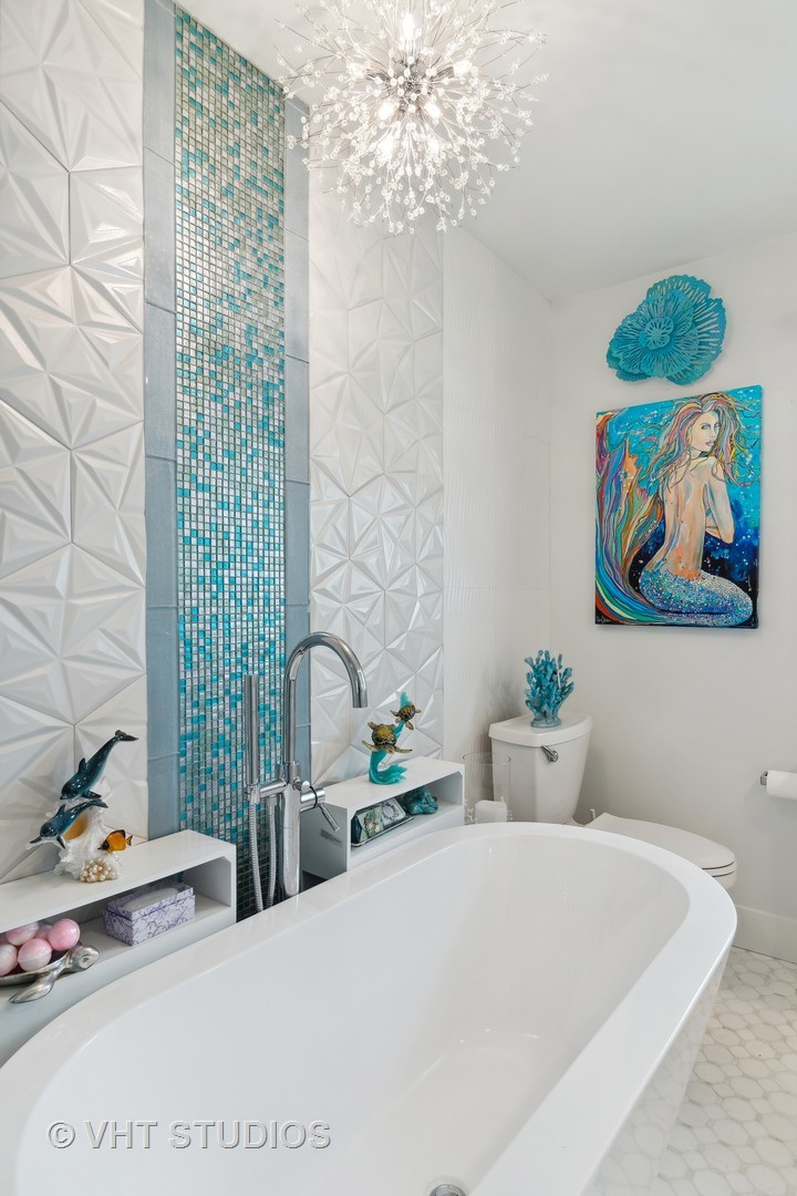 14107 Naperville Road Plainfield, IL 60544 - Photo 22 of 49 a bedroom with a bed and a painting on the wall