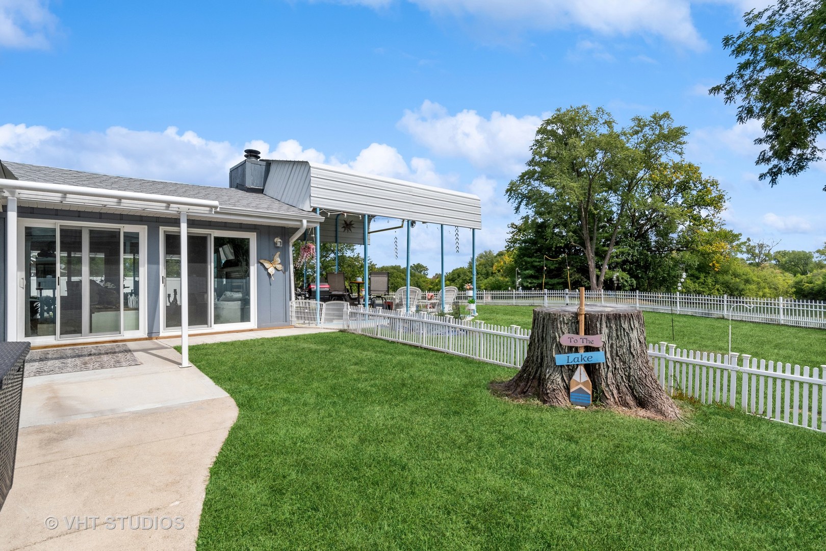 14107 Naperville Road Plainfield, IL 60544 - Photo 33 of 49 a view of a house with backyard sitting area and garden