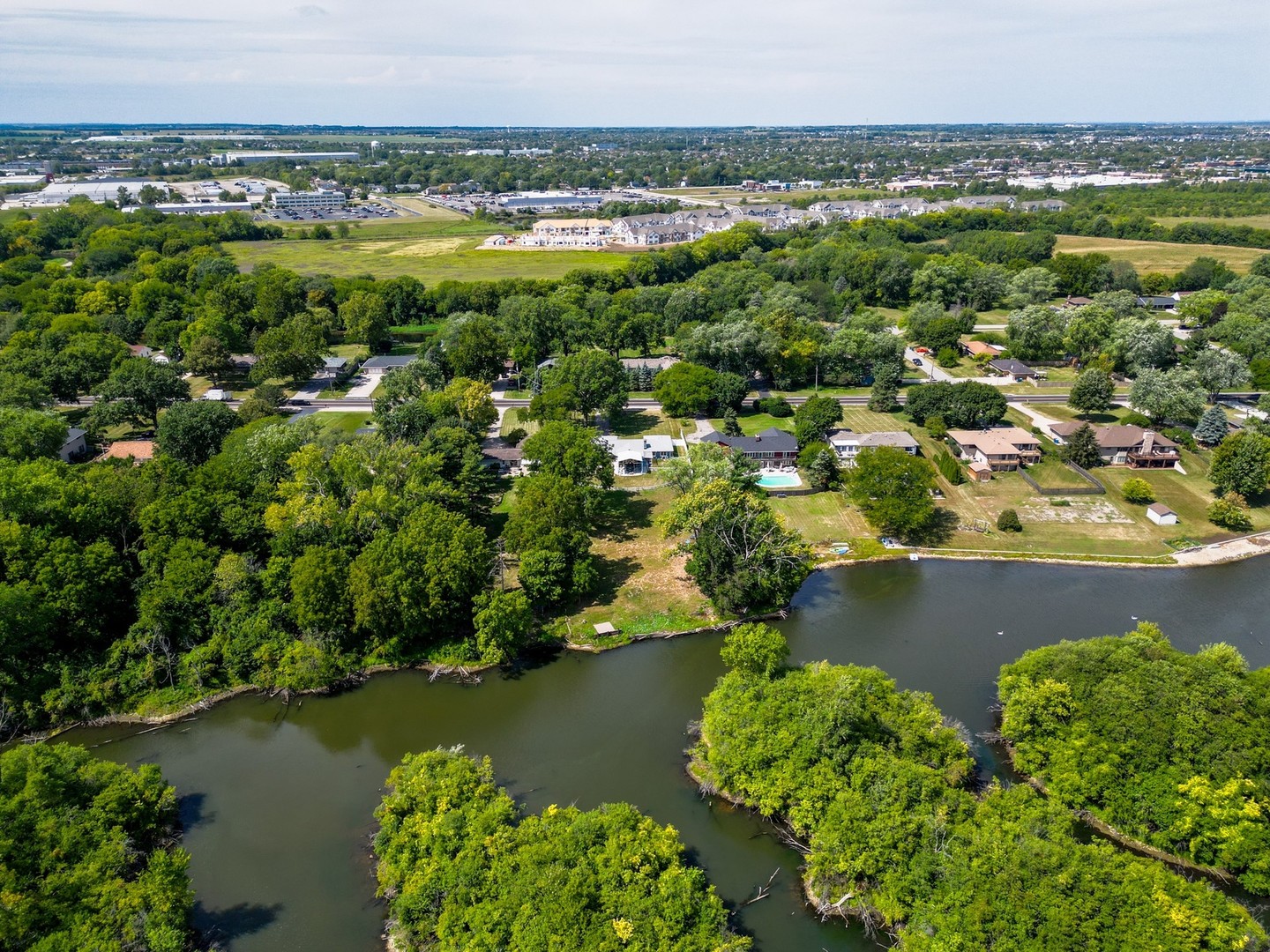 14107 Naperville Road Plainfield, IL 60544 - Photo 45 of 49 a view of a lake with a city