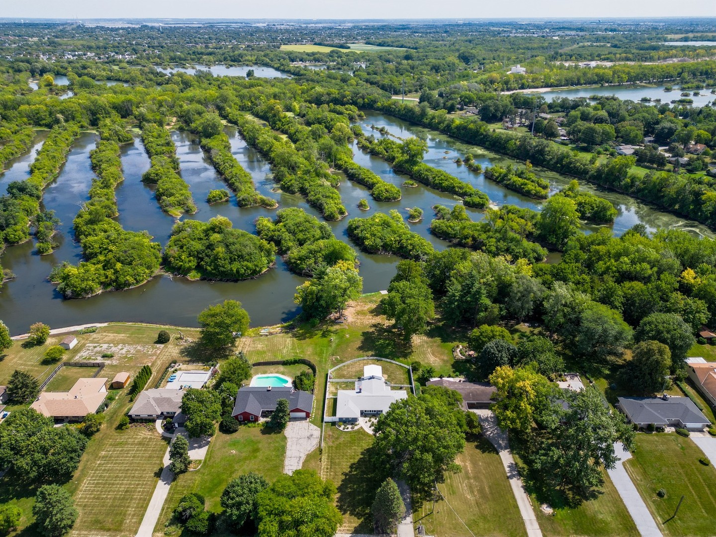 14107 Naperville Road Plainfield, IL 60544 - Photo 46 of 49 an aerial view of a city with lots of residential buildings
