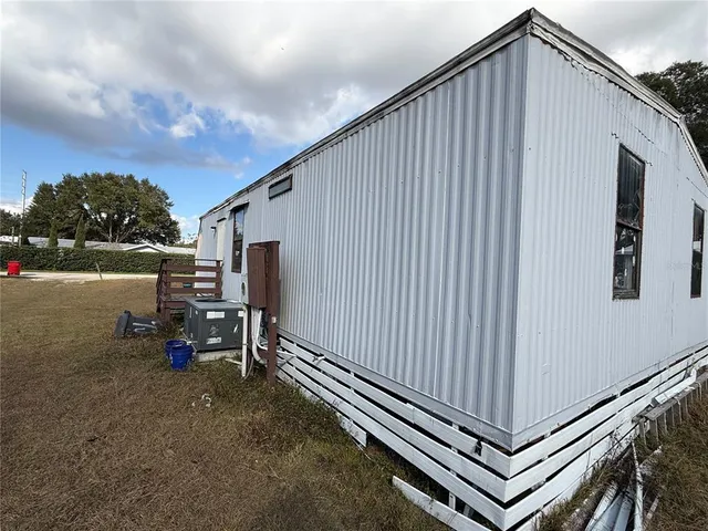 a view of a backyard with seating area