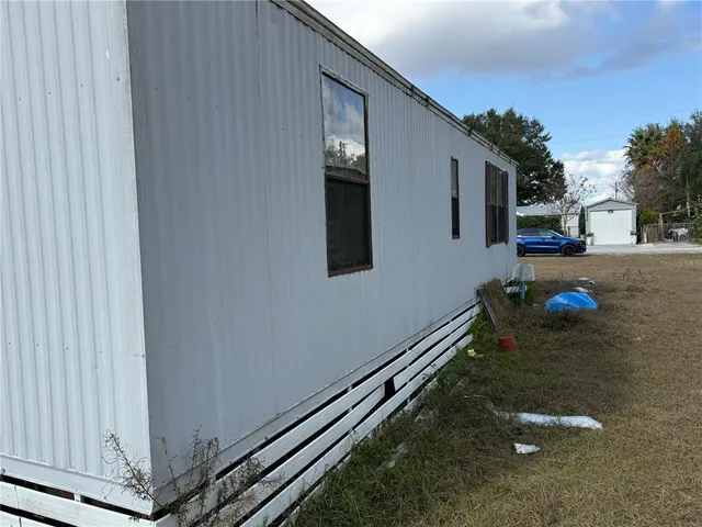 a view of a back yard of the house