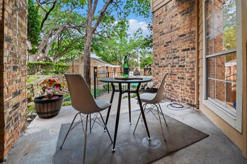 14277 Preston Road, Unit 315 Dallas, TX 75254 - Photo 4 of 20 Private patio facing pool, spa, and fountain with relaxing ambience, outdoor storage, and space for plants. The perfect spot for morning coffee or a relaxing dinner.
