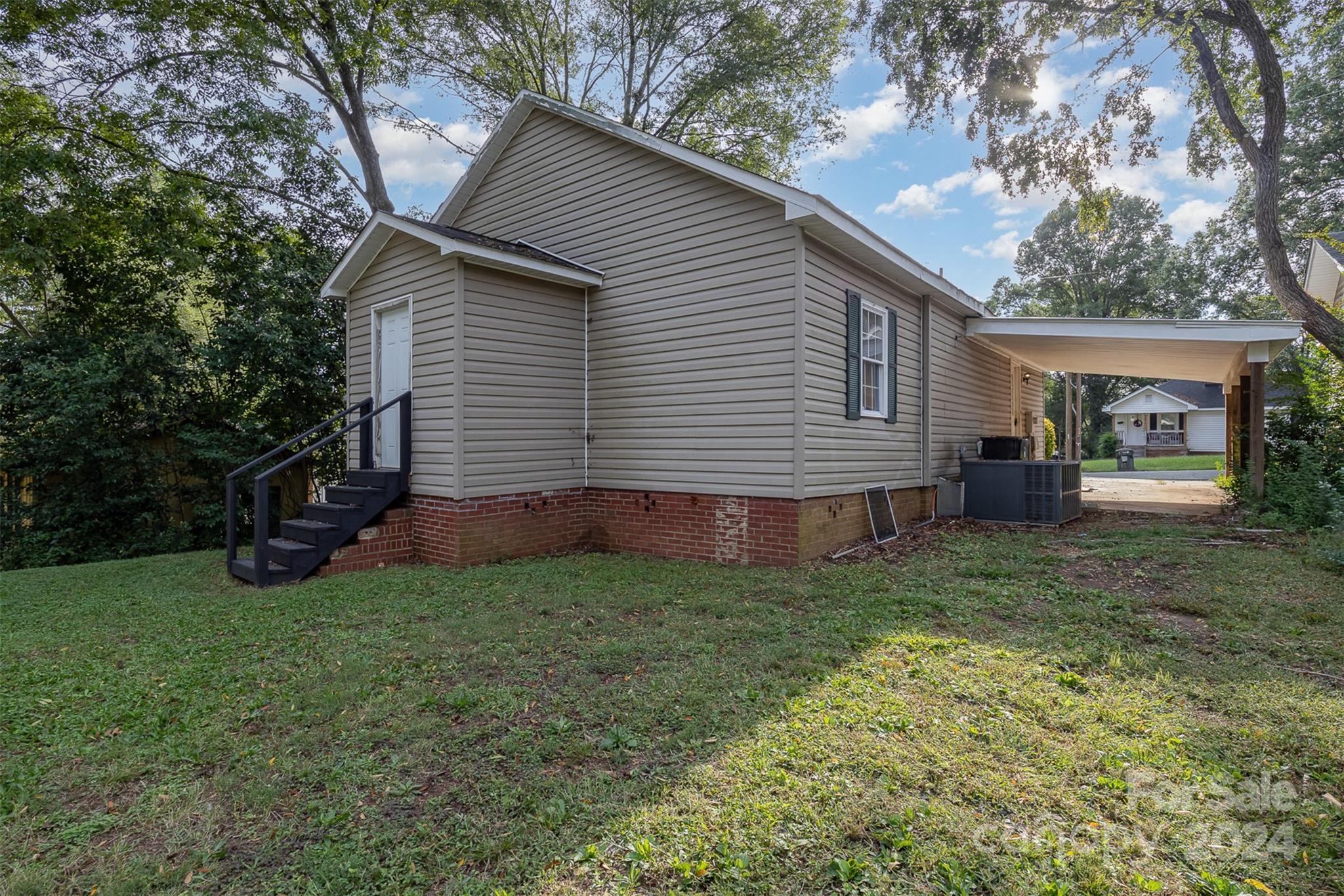 484 Cook Street Northwest Concord, NC 28025 - Photo 19 of 32 a view of a house with a backyard