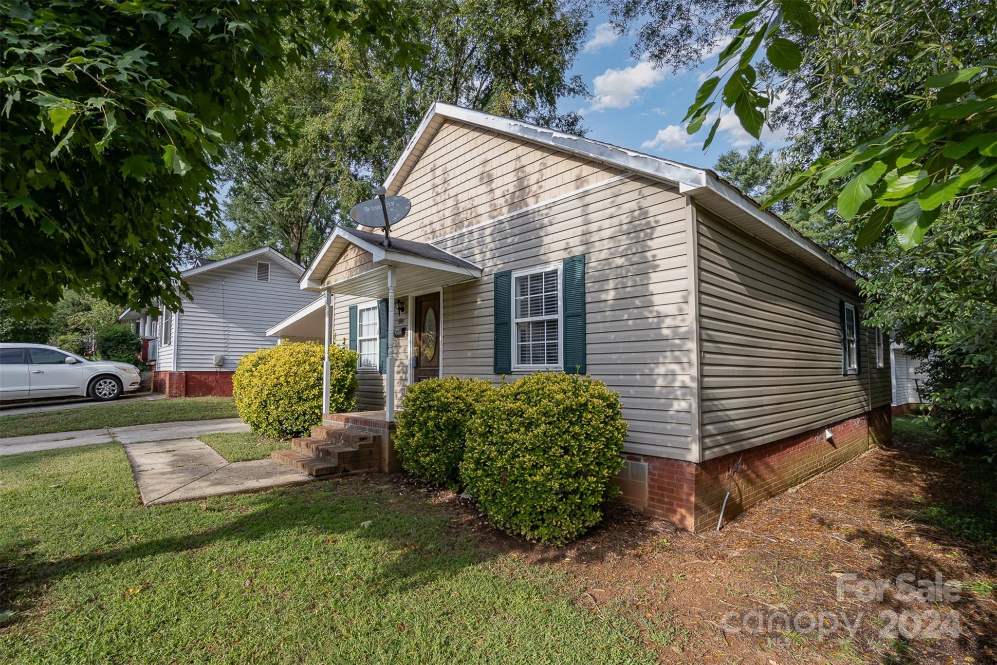 484 Cook Street Northwest Concord, NC 28025 - Photo 20 of 32 a view of a house with a yard and plants