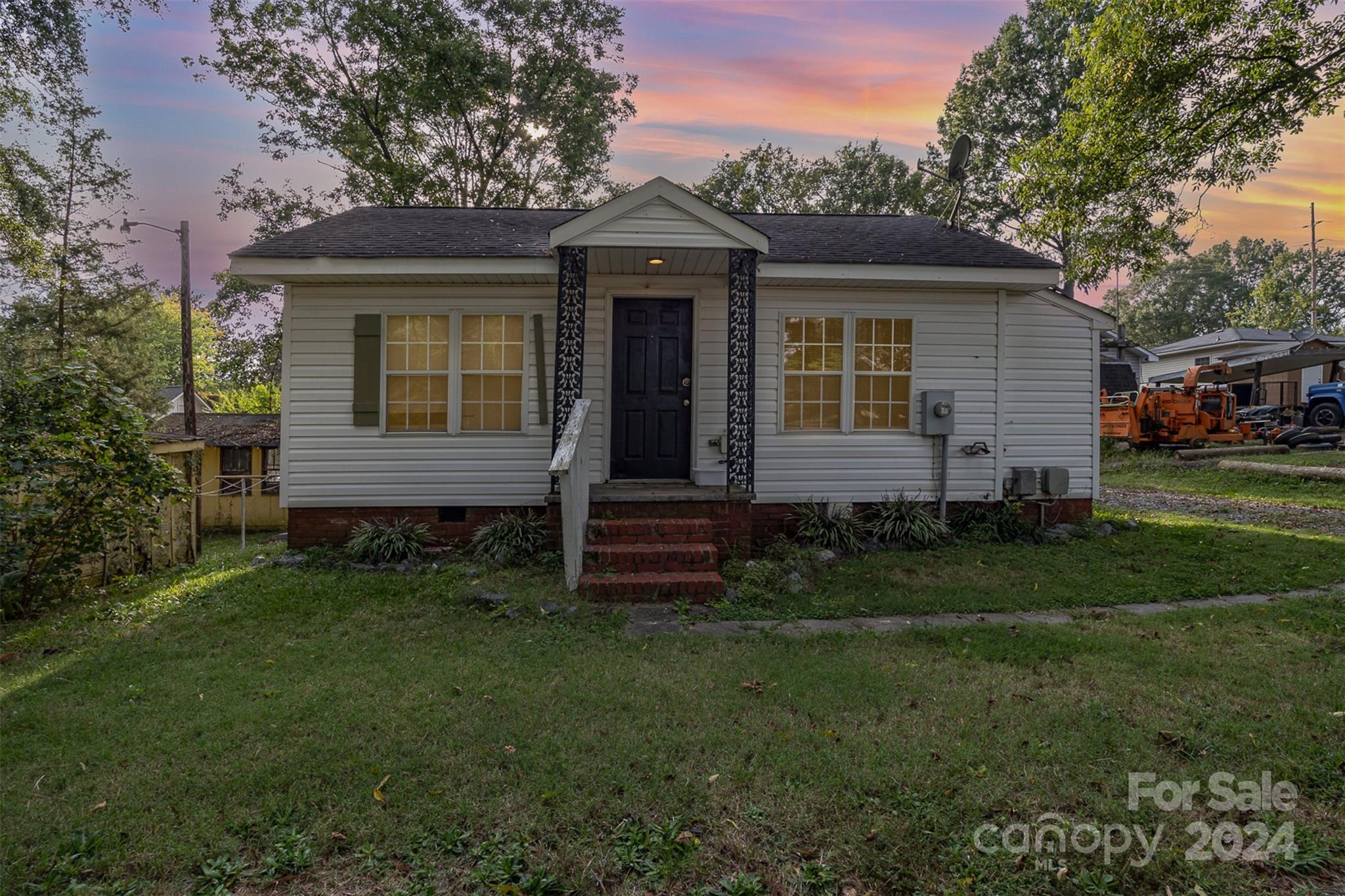 484 Cook Street Northwest Concord, NC 28025 - Photo 2 of 32 a front view of a house with garden