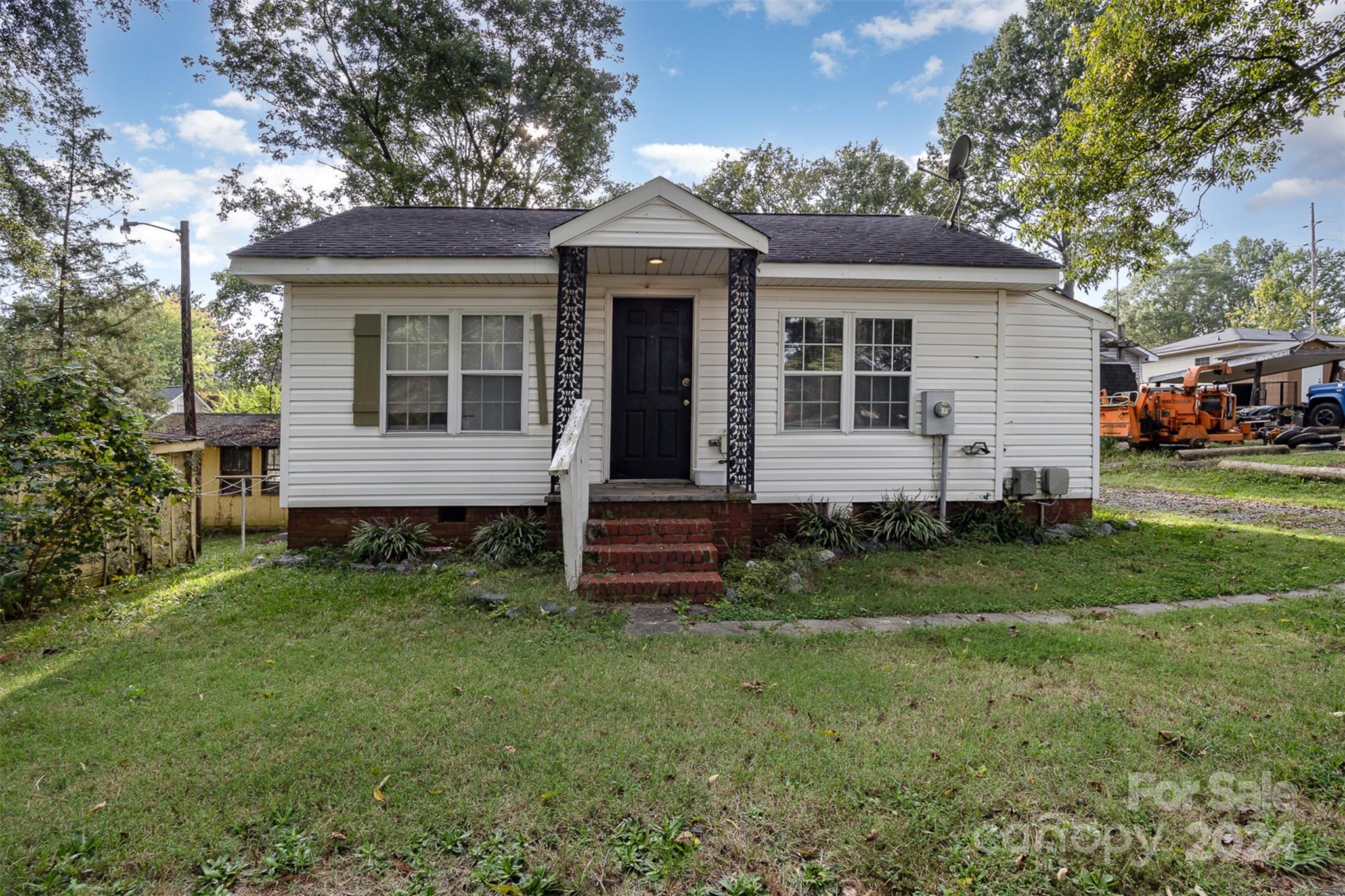 484 Cook Street Northwest Concord, NC 28025 - Photo 21 of 32 a front view of a house with a yard