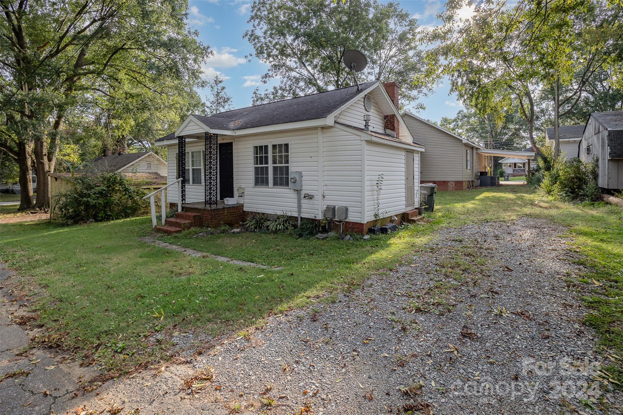484 Cook Street Northwest Concord, NC 28025 - Photo 22 of 32 a view of a house with yard and a garden