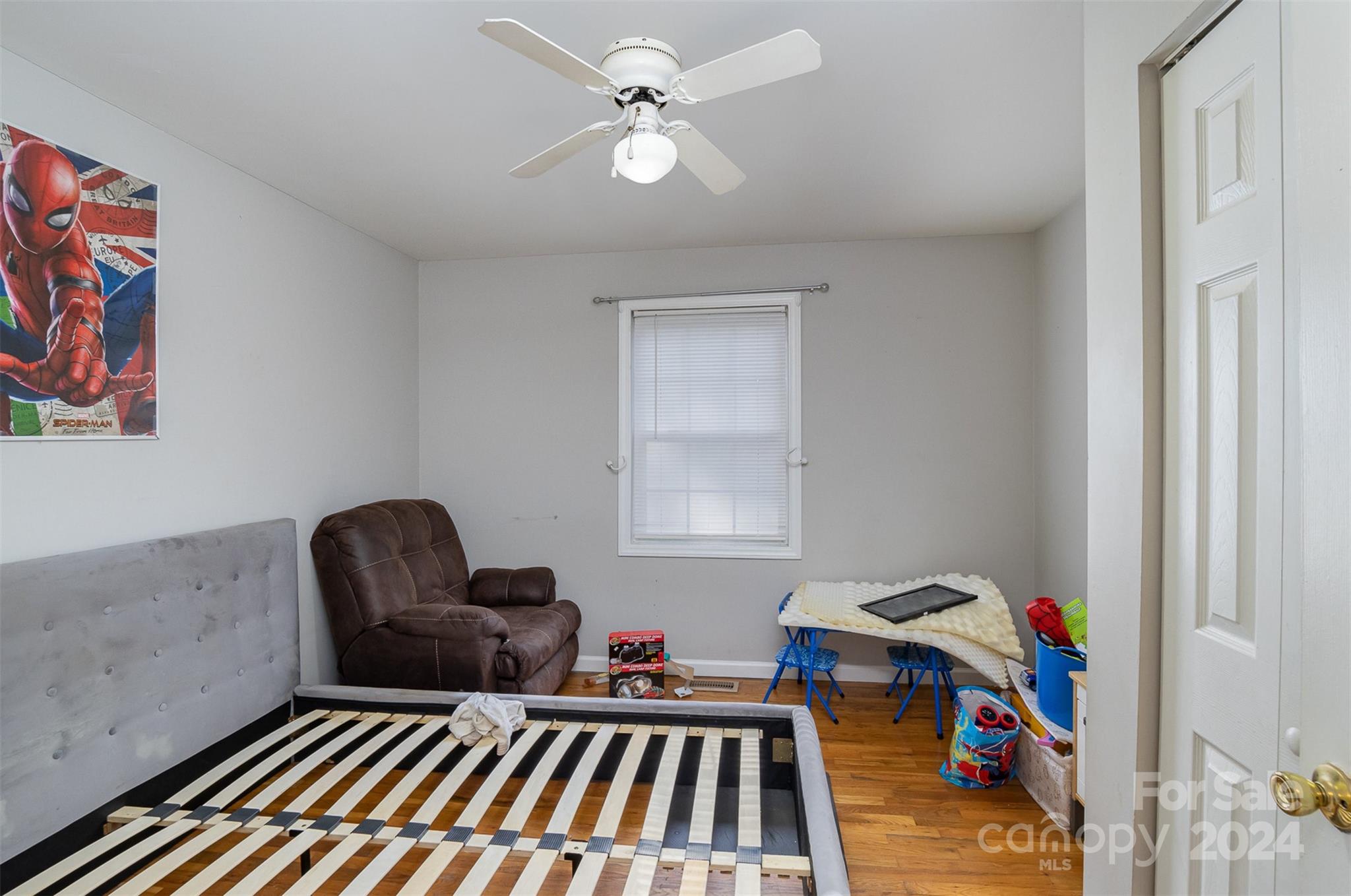 484 Cook Street Northwest Concord, NC 28025 - Photo 28 of 32 a living room with furniture and a baby crib