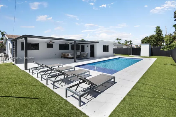 a front view of house with yard space and seating area