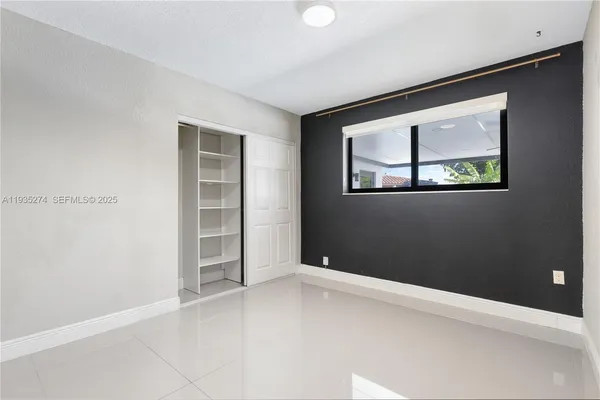 an empty room with window