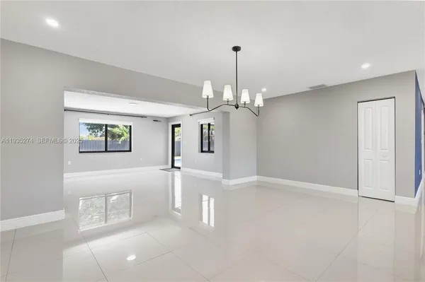 a view of a hallway with a chandelier