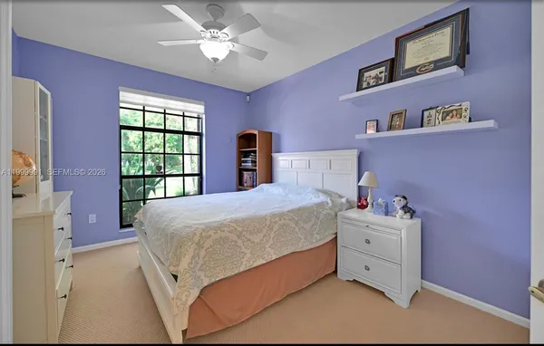 a bed room with a bed and a window