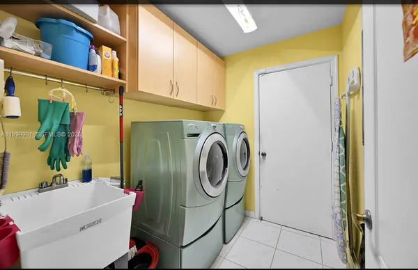 a utility room with dryer and washer
