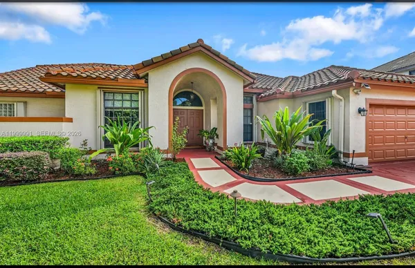 a front view of a house with a yard