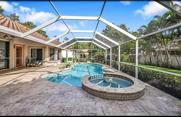 a view of a swimming pool with a patio