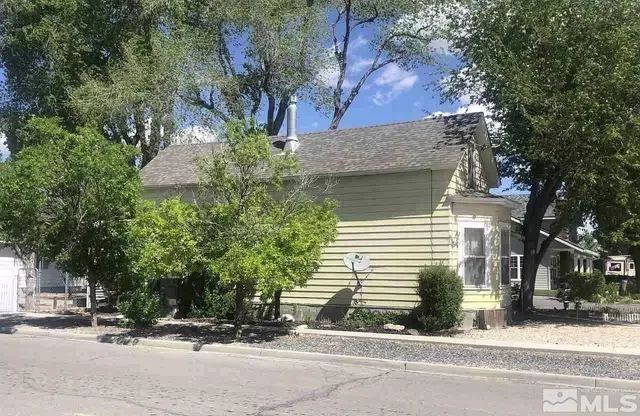 a view of a house with a street