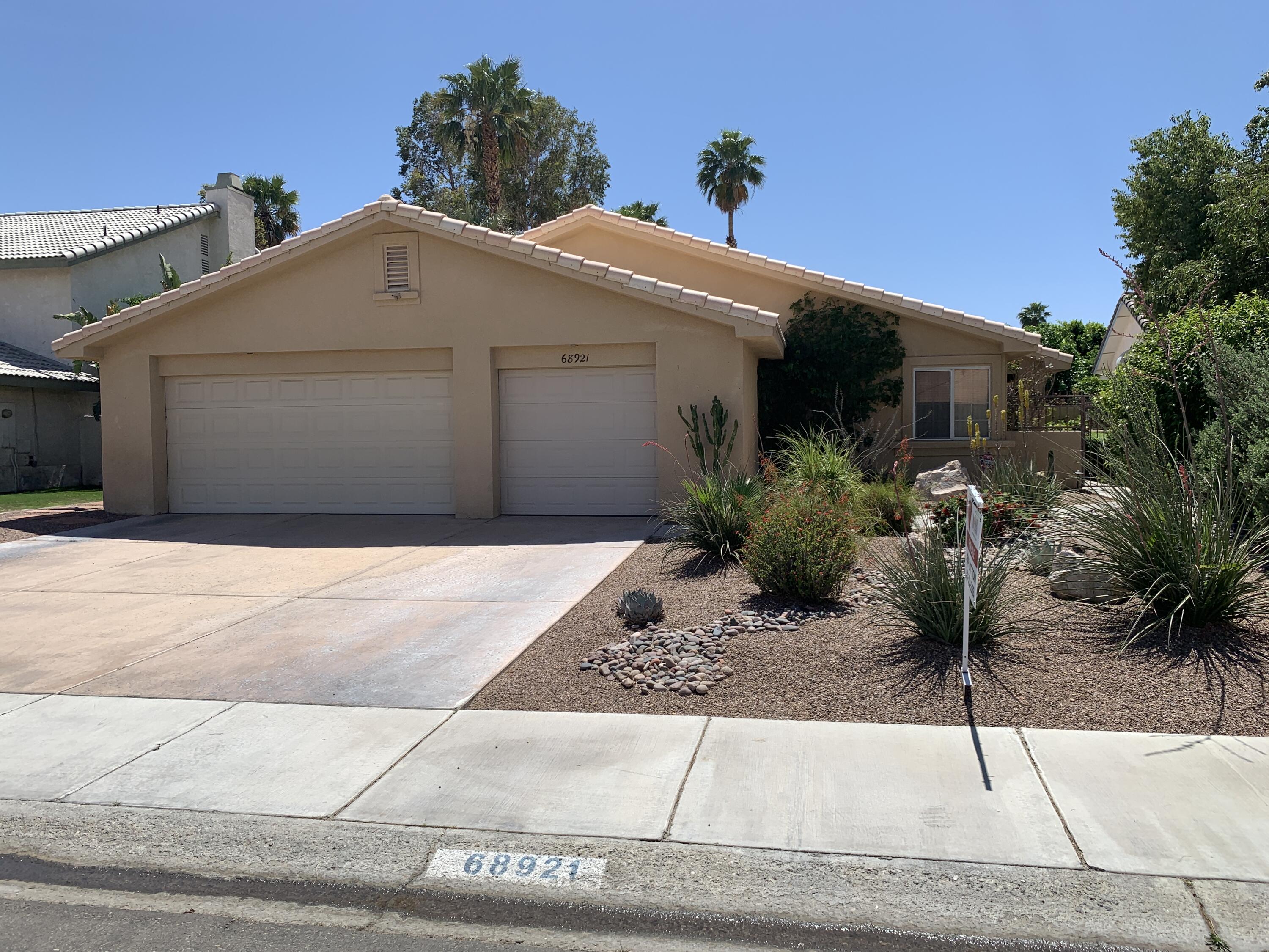 68921 Risueno Road Cathedral City, CA 92234 - Photo 20 of 20 a front view of a house with garden