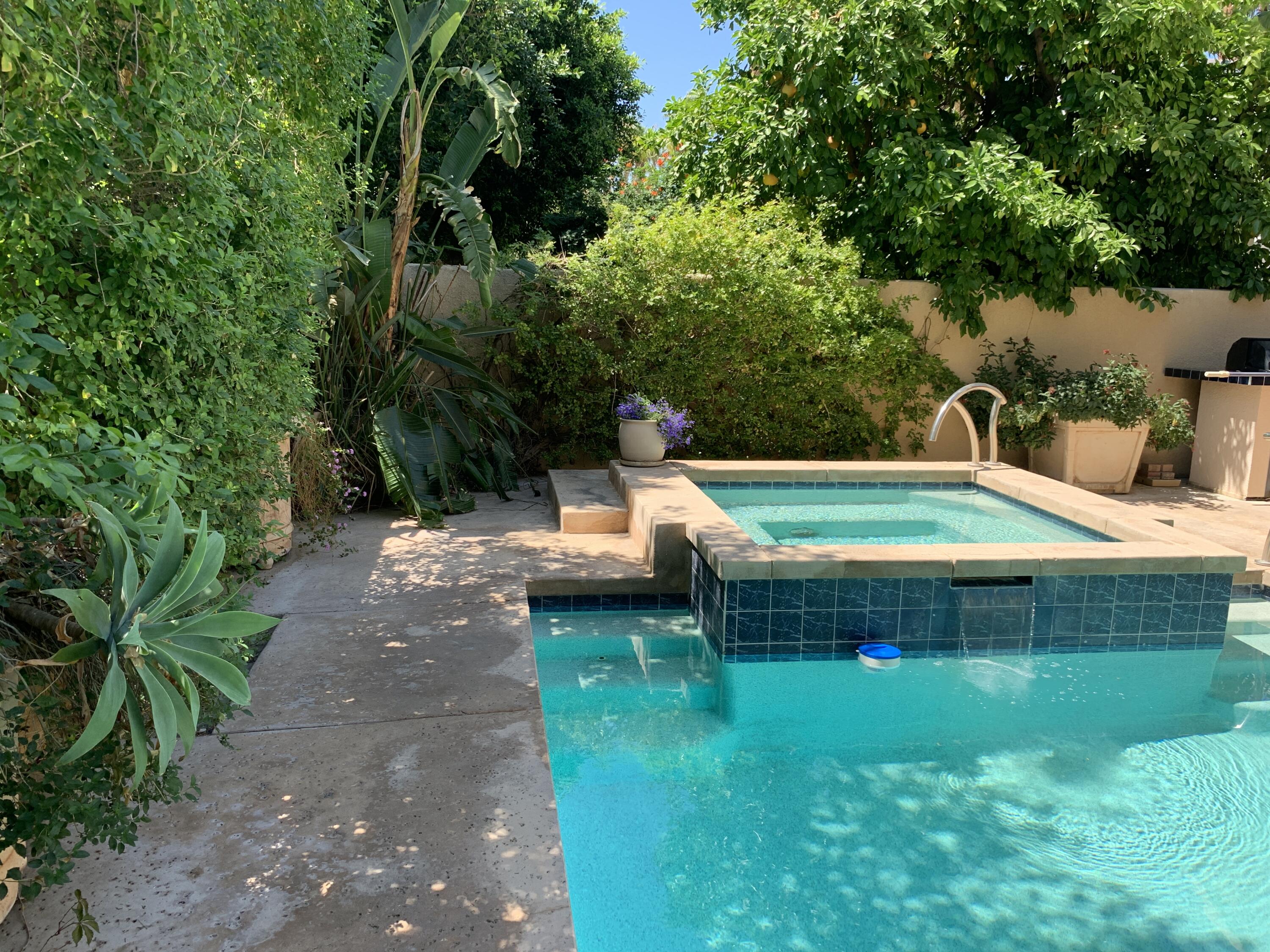 68921 Risueno Road Cathedral City, CA 92234 - Photo 5 of 20 a backyard of a house with table and chairs