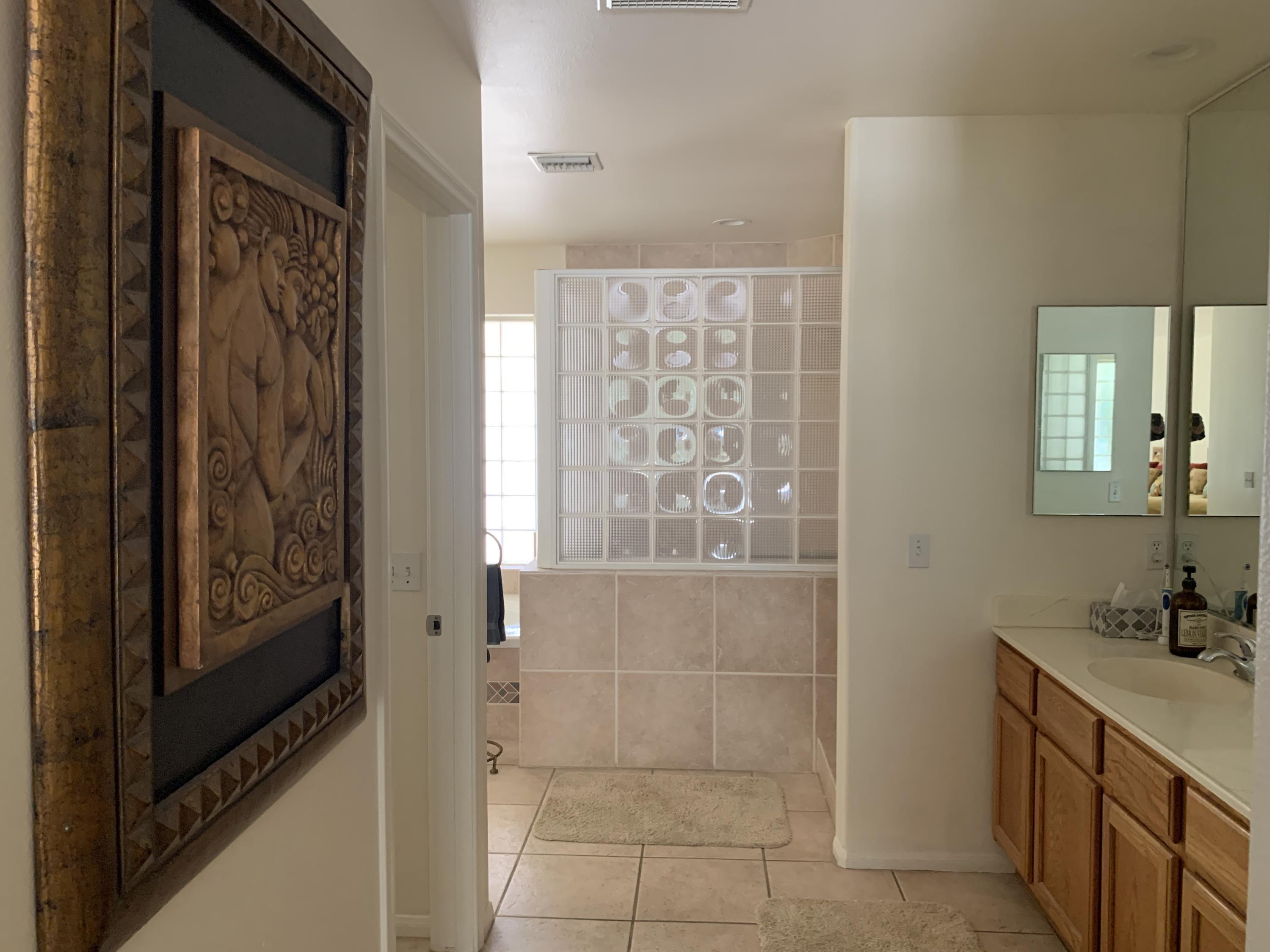 68921 Risueno Road Cathedral City, CA 92234 - Photo 8 of 20 a bathroom with a shower and a sink