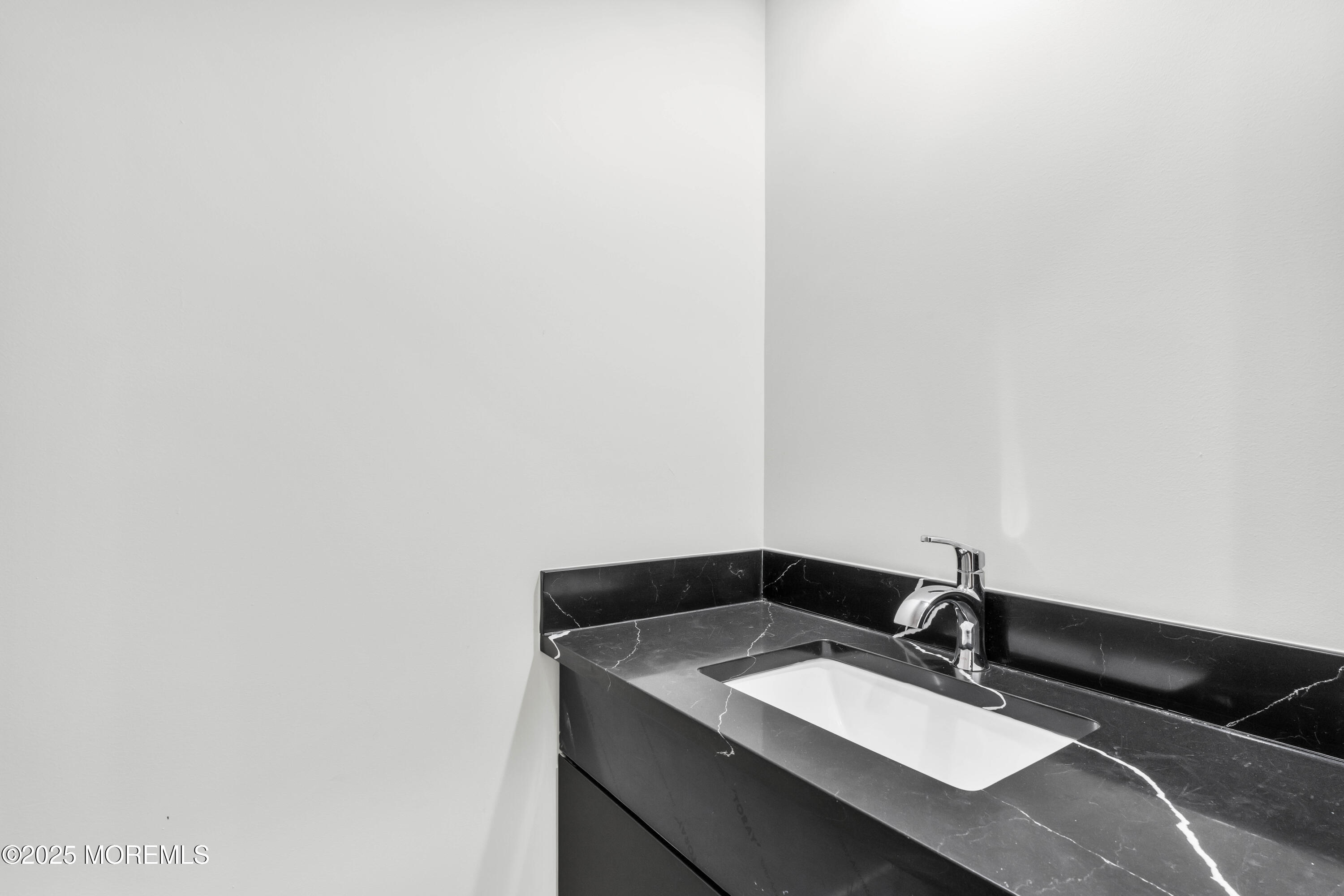 7 Broad Street, Unit 1 Red Bank, NJ 07701 - Photo 12 of 28 a bathroom with a sink and a mirror