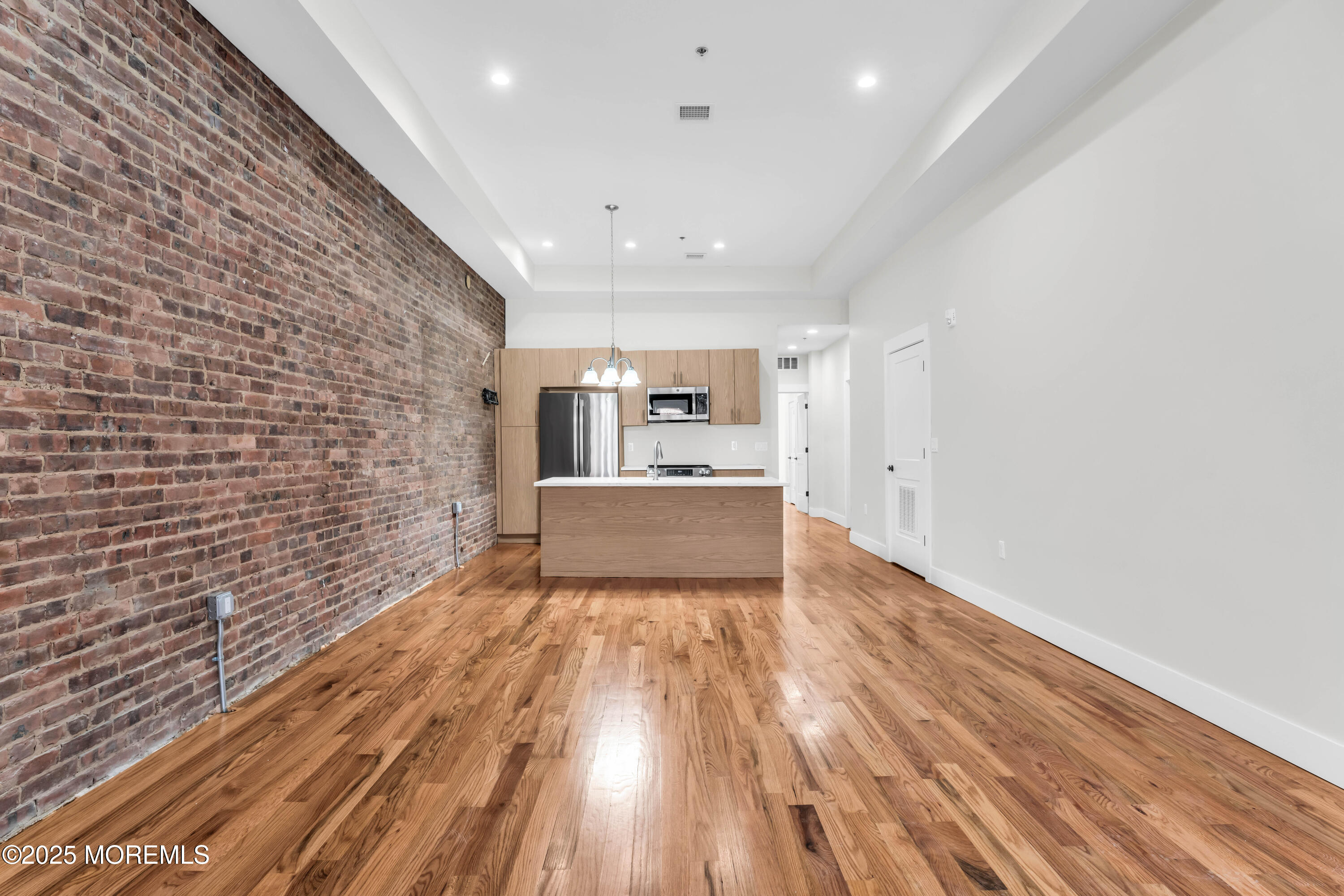 7 Broad Street, Unit 1 Red Bank, NJ 07701 - Photo 6 of 28 a view of a livingroom with wooden floor