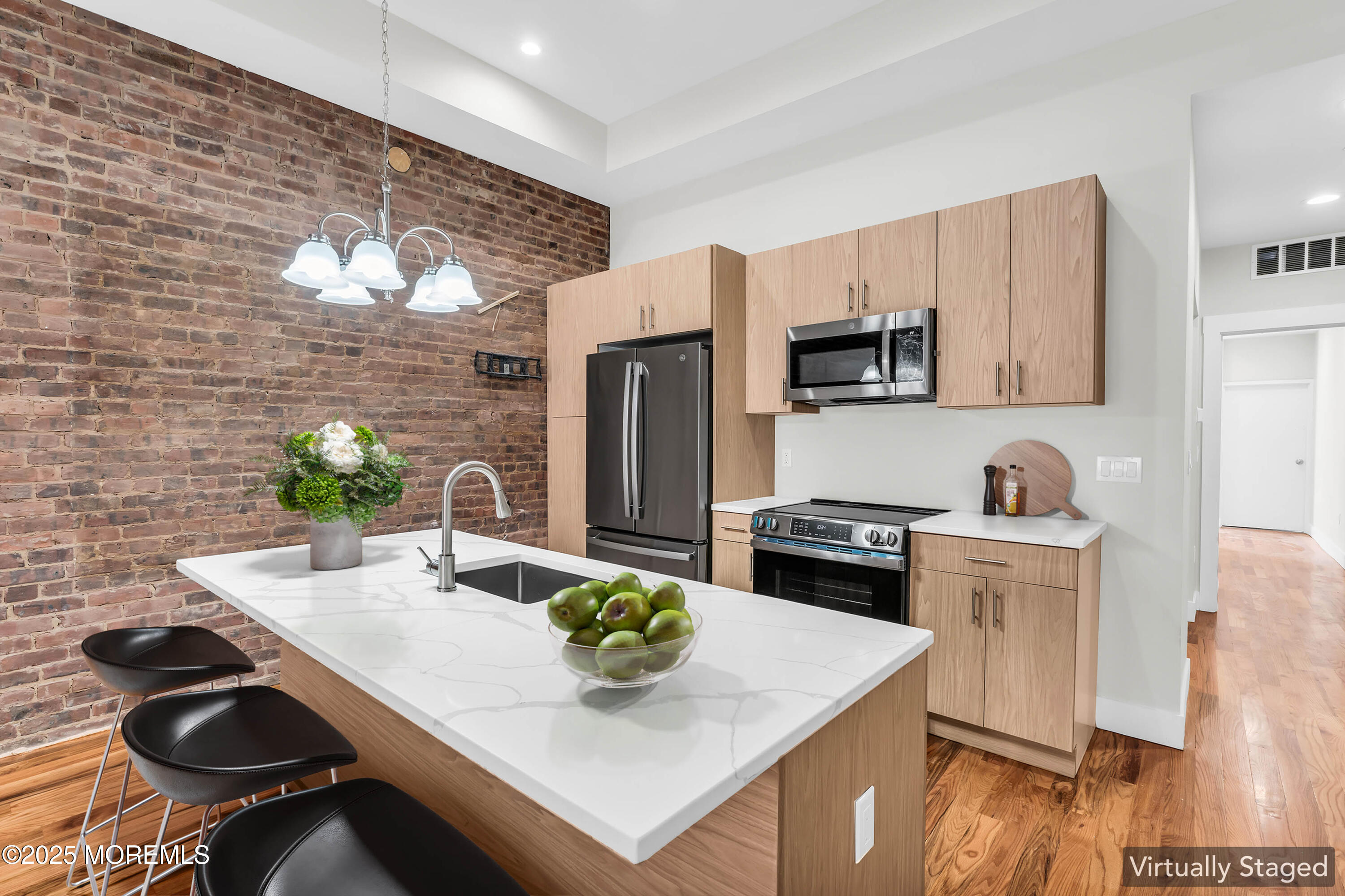 7 Broad Street, Unit 1 Red Bank, NJ 07701 - Photo 9 of 28 a kitchen with a stove a sink and a refrigerator