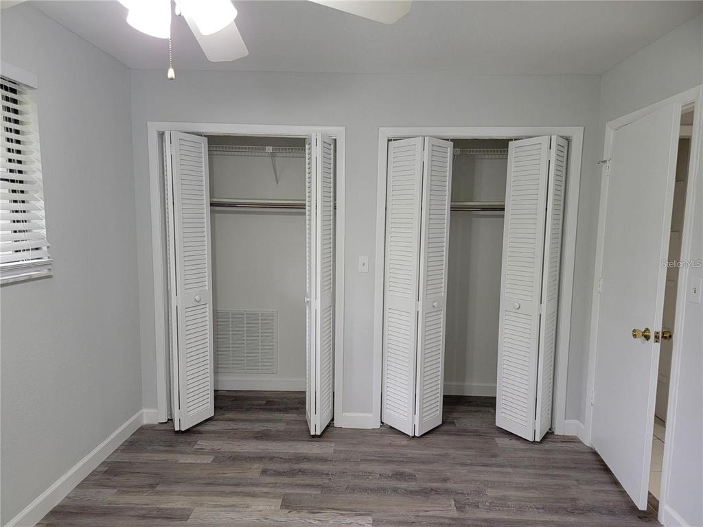 26221 Constantine Road Punta Gorda, FL 33983 - Photo 16 of 27 an empty room with wooden floor and closet area