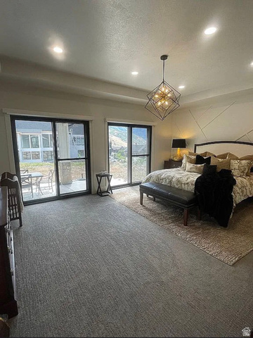 838 East Mountain Road North Ogden, UT 84414 - Photo 18 of 37 Expansive room featuring wall-to-wall carpeting and a geometric chandelier