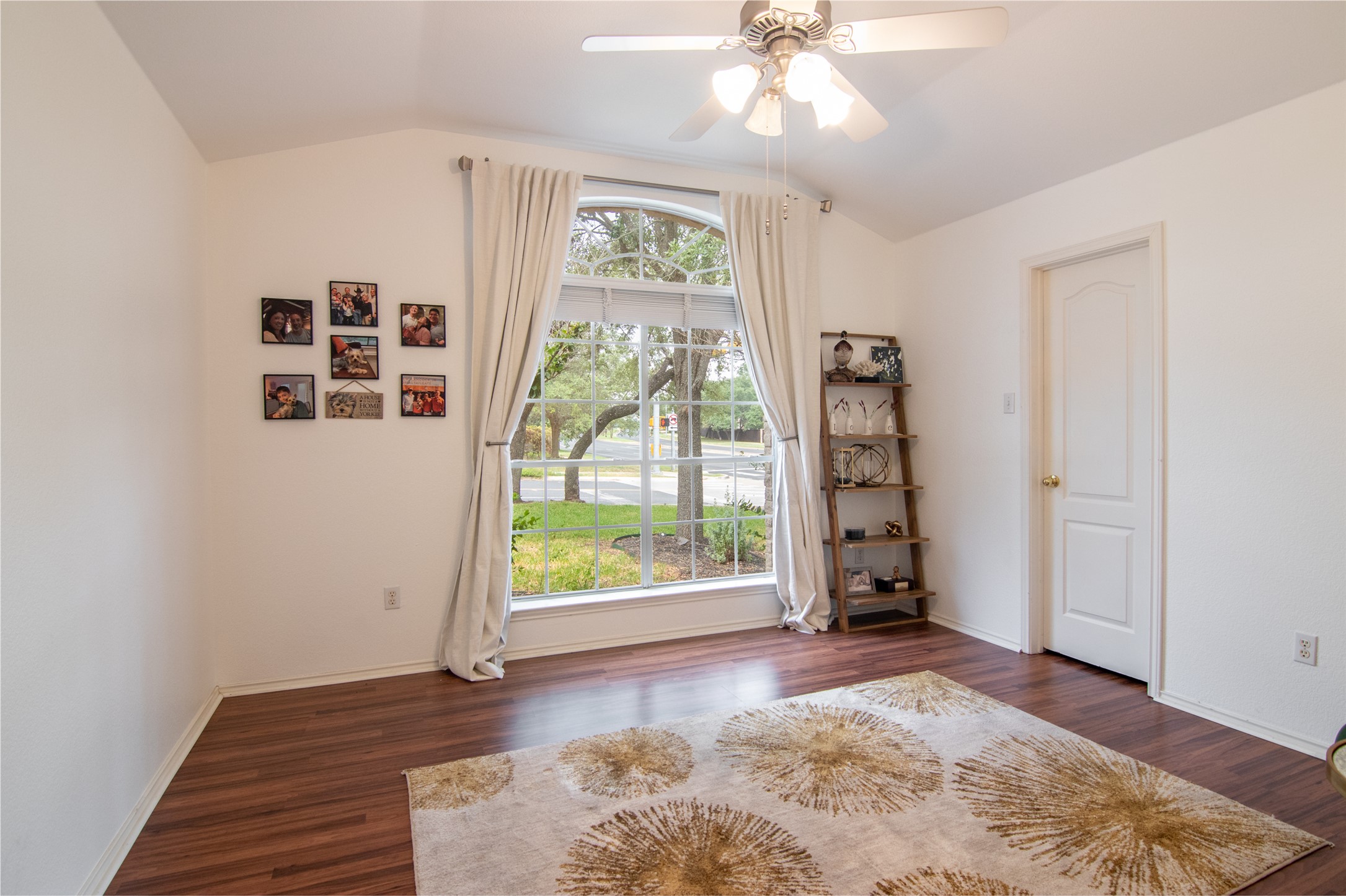 8901 Copano Drive Austin, TX 78749 - Photo 22 of 29 The front guest bedroom features a large window that fills the room with abundant natural light.