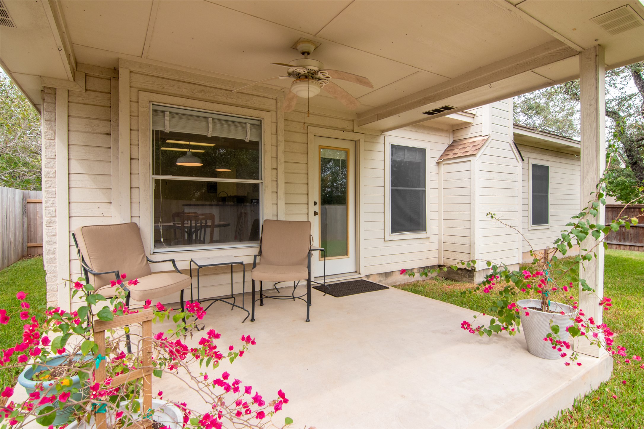 8901 Copano Drive Austin, TX 78749 - Photo 26 of 29 Inviting covered patio, perfect for relaxing and enjoying the mild weather as the seasons transition into spring.