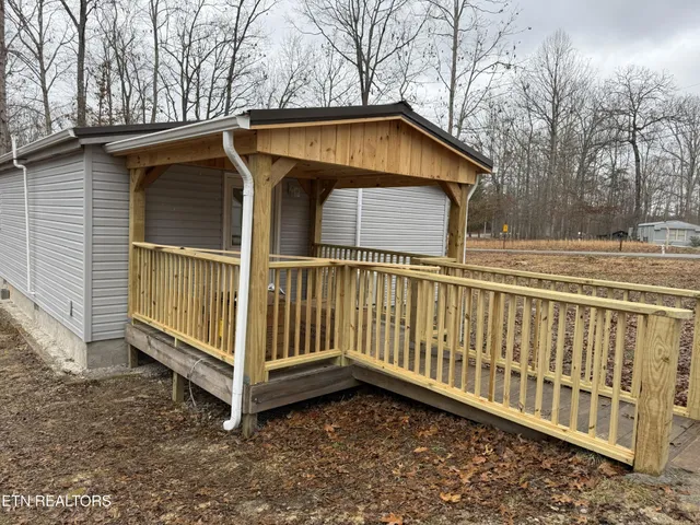a house with trees in the background